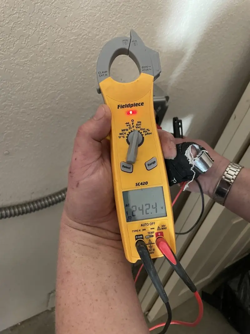 Voltage testing with clamp meter during Outlet Installation in Worthington